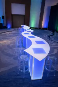 Serpentine LED table rental for trade show